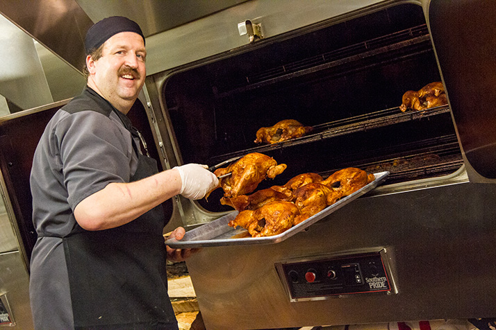 Rob Magee inspecting finishing chickens at Q39.