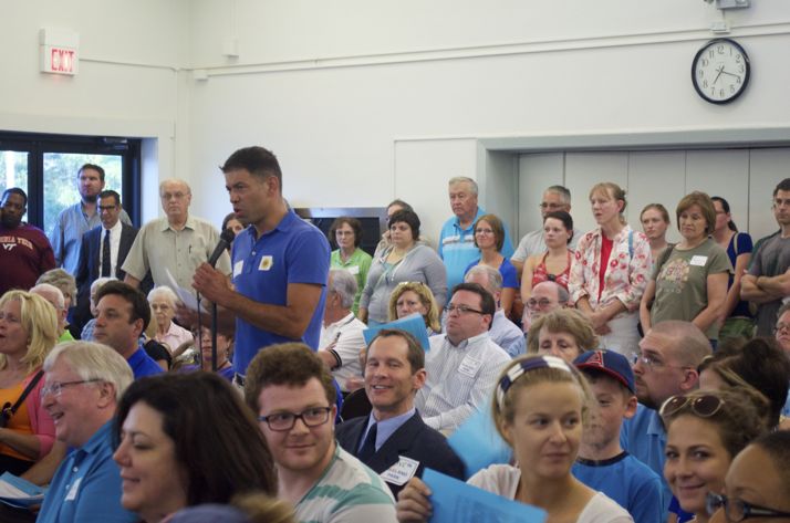 Michael Poppa addressed the standing room crowd at the Roeland Park Community Center.