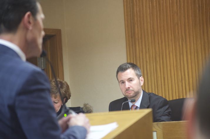 Mission City Councilor Jason Vaughn listens to developer Tom Valenti speak Wednesday night. Vaughn, who was absent for the last vote, voted in favor of the Gateway site plan.
