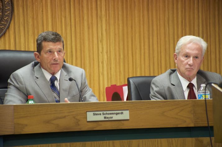 Mission Mayor Steve Schowengerdt and council member Tom Geraghty listen to residents speaking about the Gateway project at the city council meeting Wednesday.