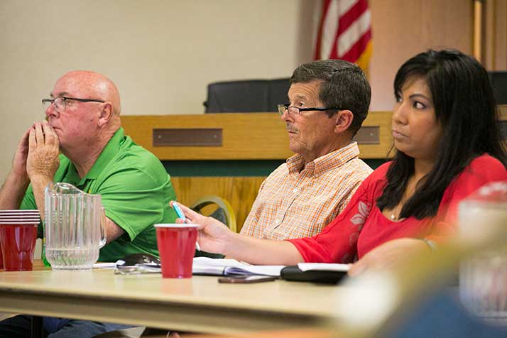 Councilman Pat Quinn, Mayor Steven Schowengerdt, and Councilwoman Arcie Rothrock listened to Valenti's presentation.