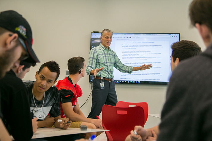 Teacher Greg Thiel worked through some top-level guidelines on a design project for his Project Lead the Way students. 