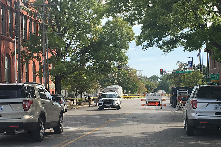 Lawrence police processed the crime scene the morning after the shooting that left three people dead.