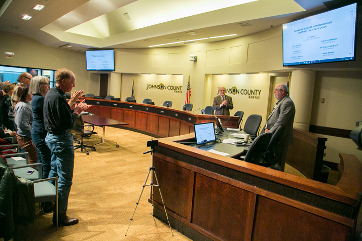 The Johnson County residents and employees who had packed the commission's hearing room erupted in a standing applause when Hannes Zacharias entered the chamber.
