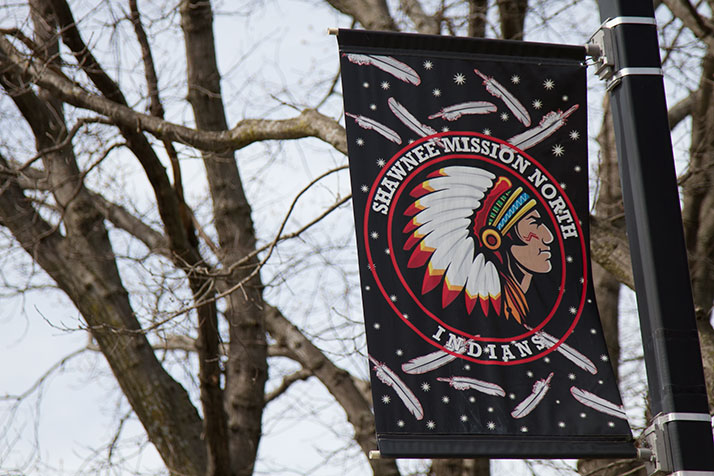 A sign showing the Shawnee Mission North High School Indian mascot
