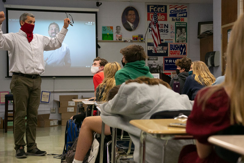 A teacher at the front of the classroom
