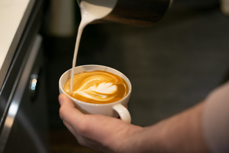 A barista makes a fresh latte at Urban Prairie in Mission. File photo.
