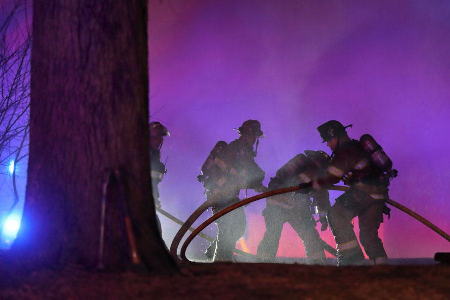 Firefighters battle a Shawnee house fire in February.
