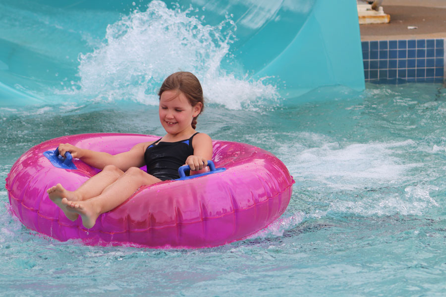 Prairie Village pool patron uses slide. JoCo pools 2024