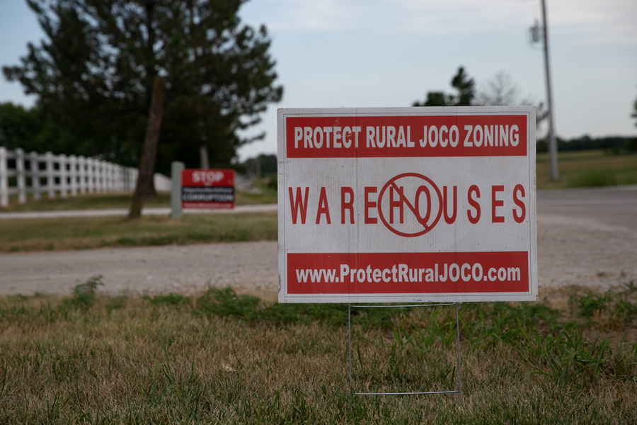 Signs in Edgerton opposing a 600-acre warehouse development, now at the heart of a lawsuit filed by Kansas Attorney General Kris Kobach.
