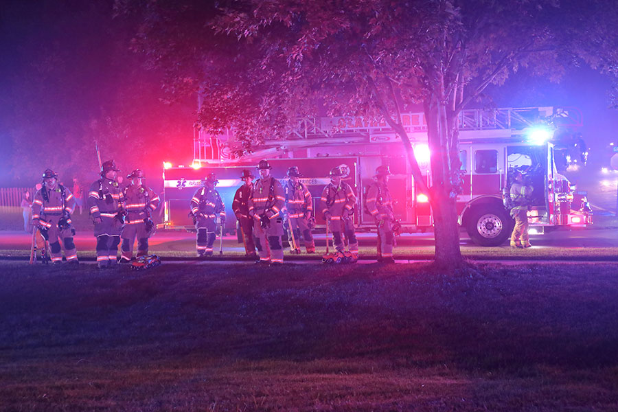 Lenexa and Olathe firefighters awaiting assignment near the scene of a Shawnee fire that injured five firefighters in July 2022.