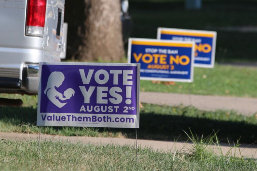 Yard signs for and against the anti-abortion Value The Both amendment, rejected by Kansas voters in 2022.