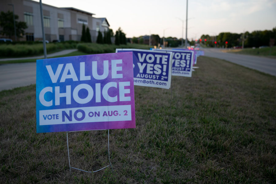 Signs on either side of the abortion amendment issue this past summer.