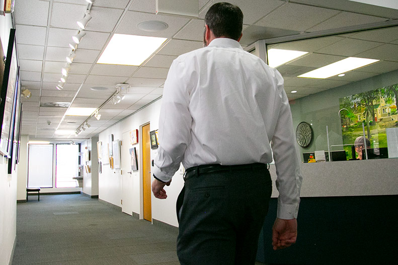 Prairie Village city staff member walks down main hallway in city hall