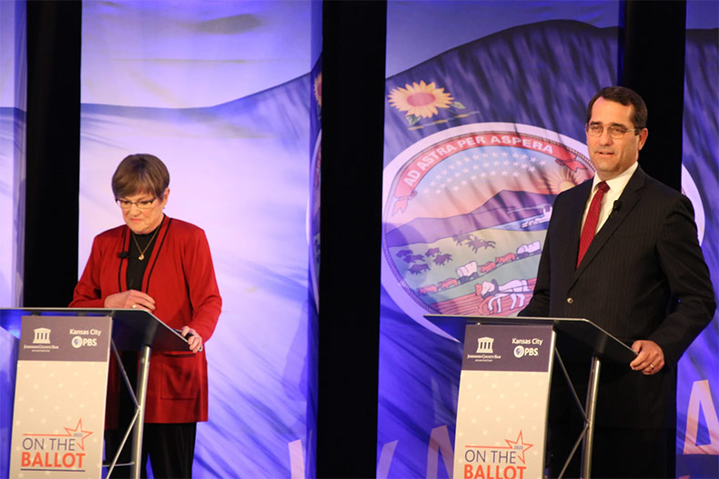 Gov. Laura Kelly and Attorney General Derek Schmidt debate a transgender athletes ban.