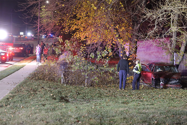 A car involved in an Overland Park wreck on 95th Street damaged a home's fence.