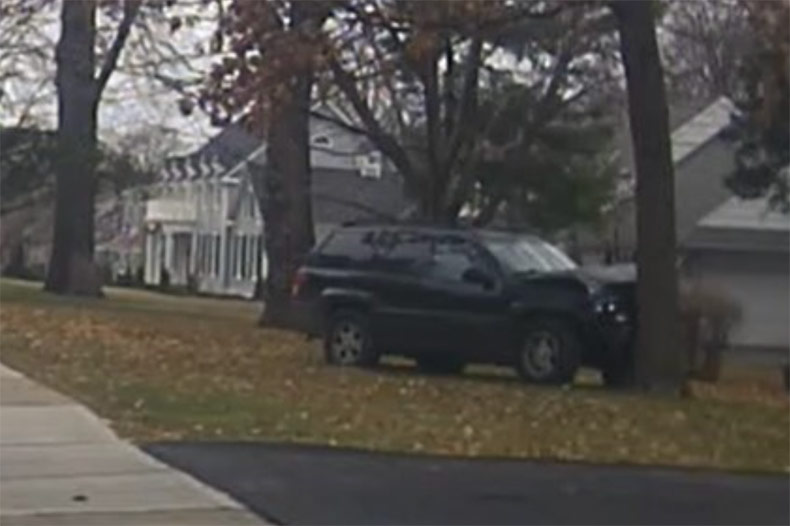 The stolen SUV after it crashed into a tree along Belinder in Mission Hills.