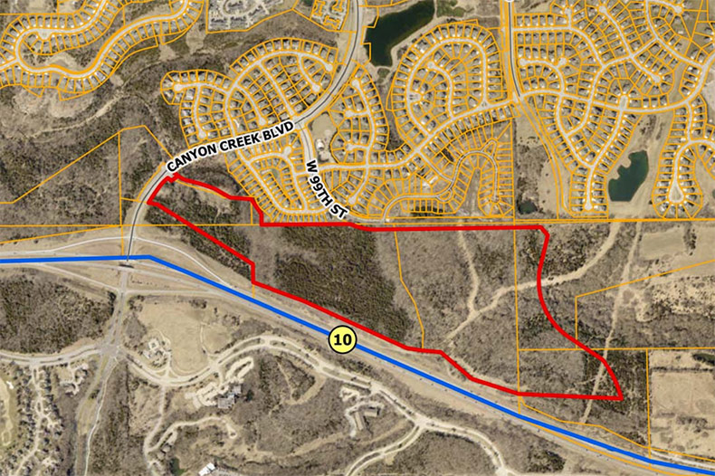 An aerial map of the Canyon Creek West site just north of K-10, outlined in red. 