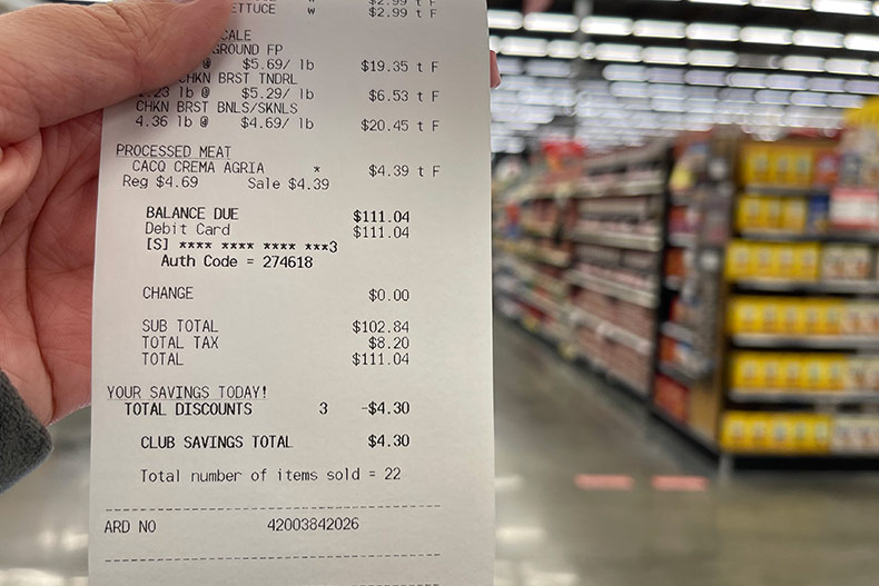 A grocery receipt from Price Chopper in Roeland Park, showing $8.20 in taxes on a $102 bill.