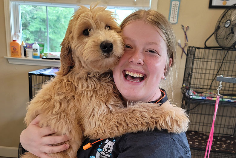 A dog and a person at Grooming by Rebekah in south Overland Park.