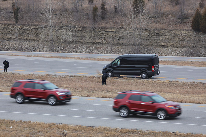 Investigators look for evidence on the scene of deadly shooting on I-435 in Lenexa. 