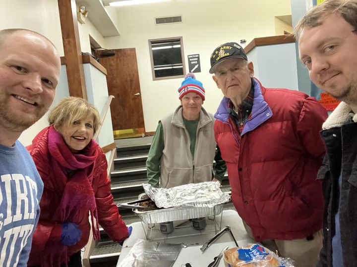 Volunteers pack up pulled pork sandwiches for the Lenexa United Methodist Church's Wednesday night meal service.