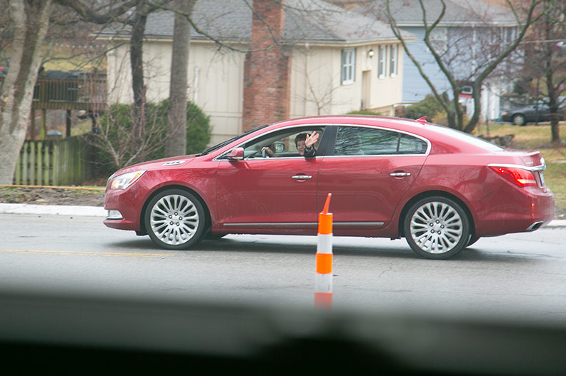 David Perryman parade attendees wave from their cars