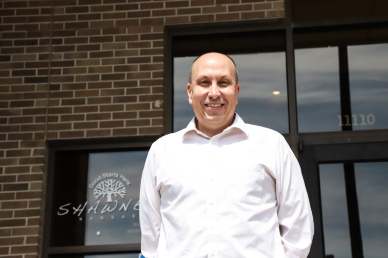 Doug Gerber is the new city manager in Shawnee. He's pictured in front of Shawnee City Hall on a sunny day in March 2023.