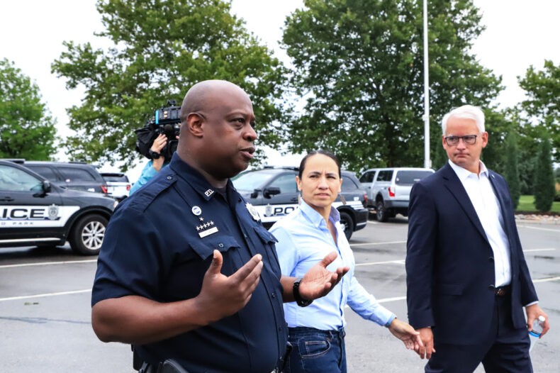 Rep. Davids (center) pictured with Officer John Lacy and Mayor Curt Skoog outside the Overland Park Justice Center fitness center. On Monday, July 31, Davids visited the department for a conversation, tour and ride along.