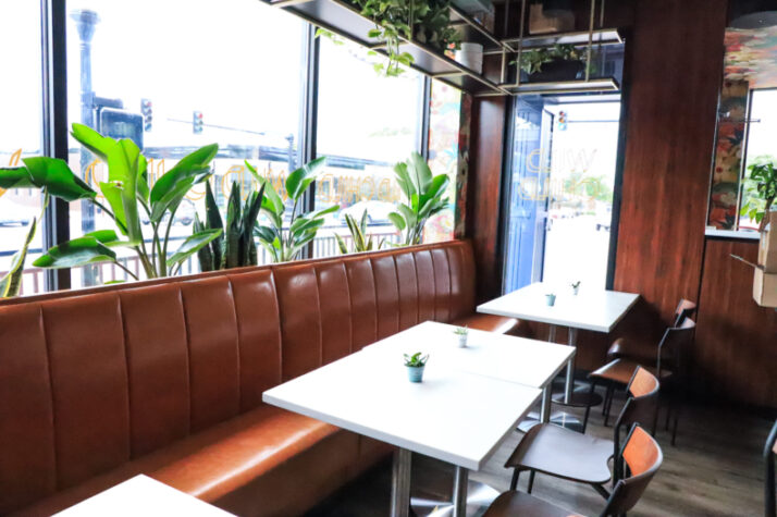 The vibe at Wild Child in downtown Shawnee is warmer and more casual than its sister establishment next door. The new bar is complete with plants, big windows and floral wallpaper. 