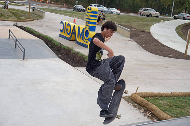 A skate performs a trick at Rolling Magic Skate Park