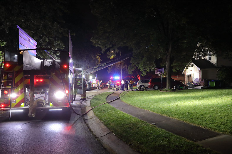 Fire crews on the scene in Shawnee early Saturday after a house fire and disturbance. 