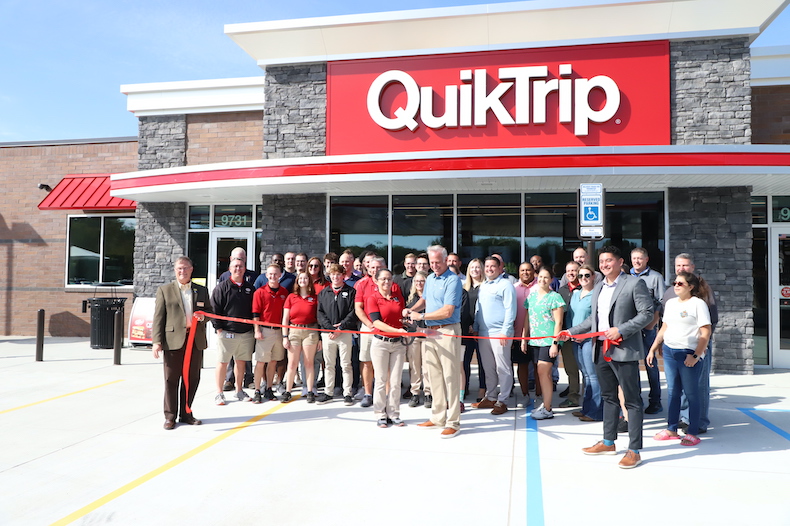 QuikTrip employees and local leaders celebrate the opening of the 100th active QuikTrip in Kansas City. This store is in Overland Park.