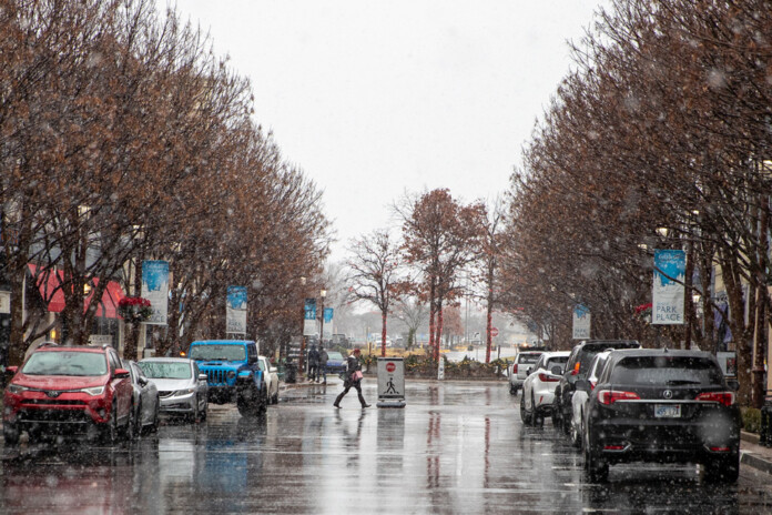 The early edge of a winter storm as flurries come down in Leawood in Johnson County Monday.