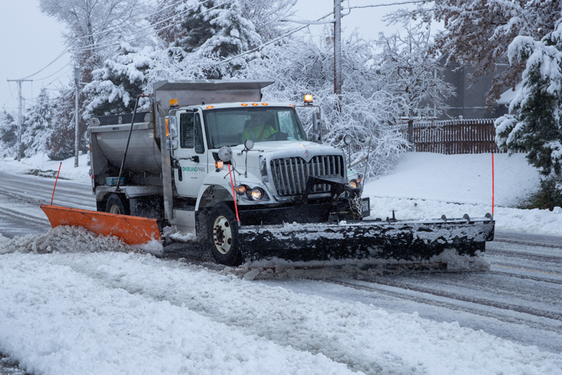 A snow plow clears Nieman Road on the morning of Tuesday, Jan. 9.