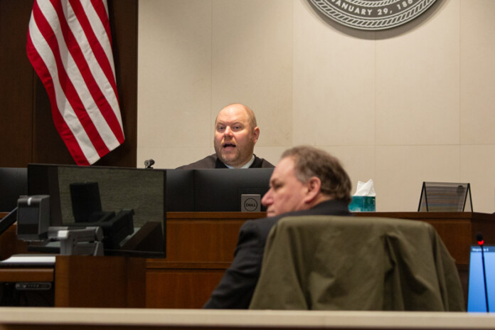 Judge McEntee listens during an eviction hearing on the morning of Friday, Jan. 12.