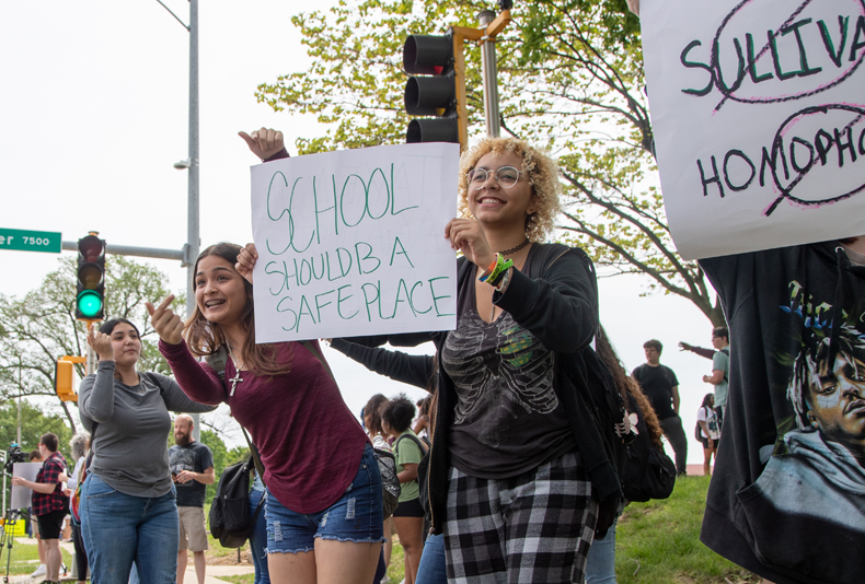 SM North students walkout to protest an English teacher who wrote an op-ed about "woke ideology" being taught in the district.