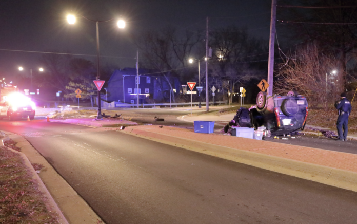 A SUV ended up on its roof after the driver collided with boulders in a roundabout near Olathe North High School Monday night.