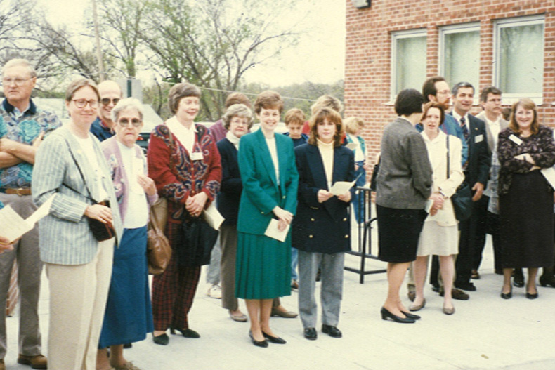 People gather outside of the Antioch Library branch for a re-opening ceremony in 1996, which came after the opening of the Central Resource Library in Overland Park. Photo courtesy Johnson County Library. 