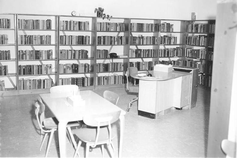 Shelves line the walls inside Antioch Library circa 1956 to 1957. Photo via JoCo History. 