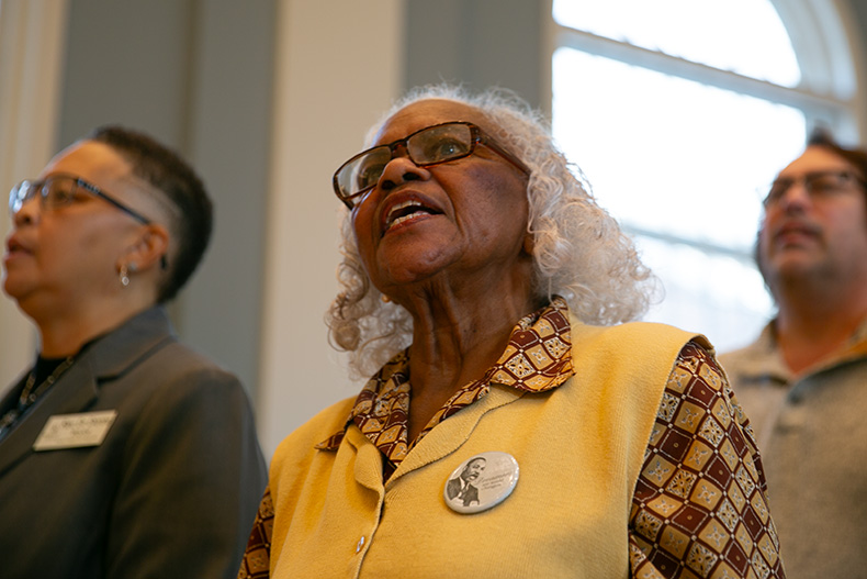 The crowd joins in on singing. 