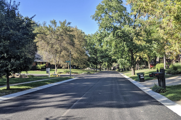 A street preserved using ultrathin bonded asphalt surface, or UBAS, in Overland Park.