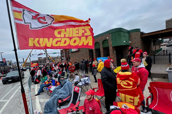 Chiefs fans line up along Grand Boulevard in Kansas City before the start of the Super Bowl victory parade on Feb. 15, 2023. Photo credit Carlos Moreno/KCUR 89.3.