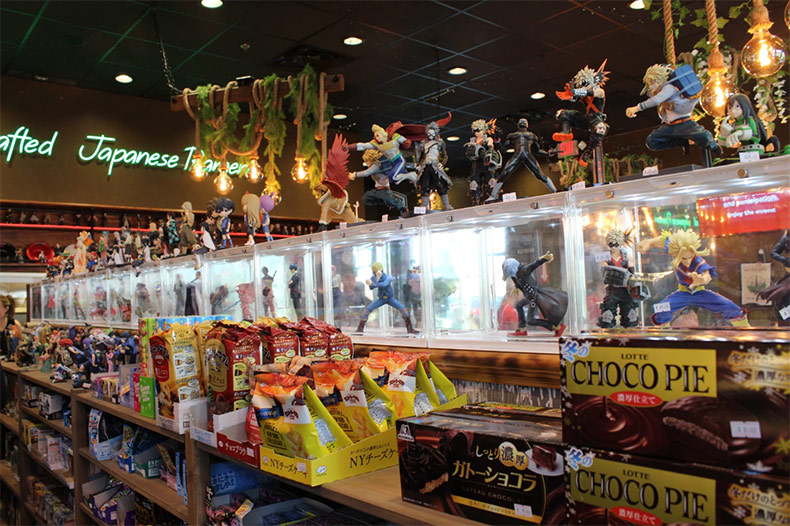 Once inside the restaurant, diners are ushered into a narrow aisle lined with Anime action figures, colorful Japanese snacks and glowing cases of refrigerated Asian sodas, beers and more.
