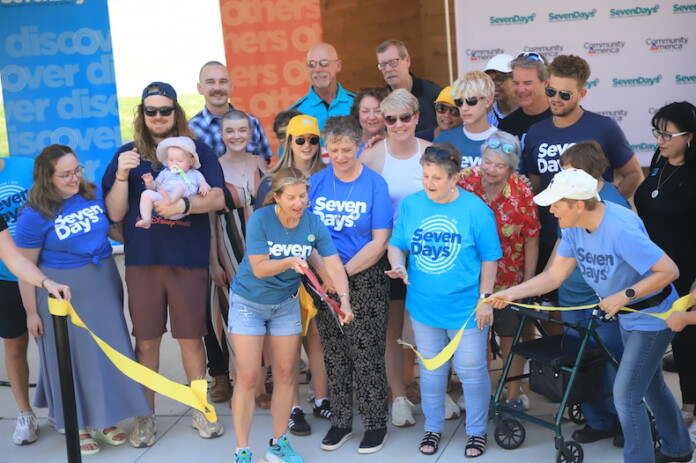 Members of the extended Corporon family and the SevenDays board cut the ribbon on a memorial amphitheater at the Jewish Community Center called Reat's Place.
