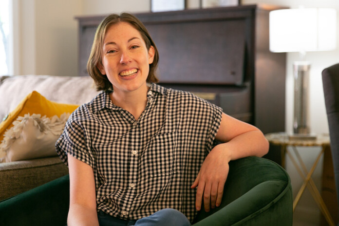 Claridge Court UMKC student Beth Christensen sits in her apartment.