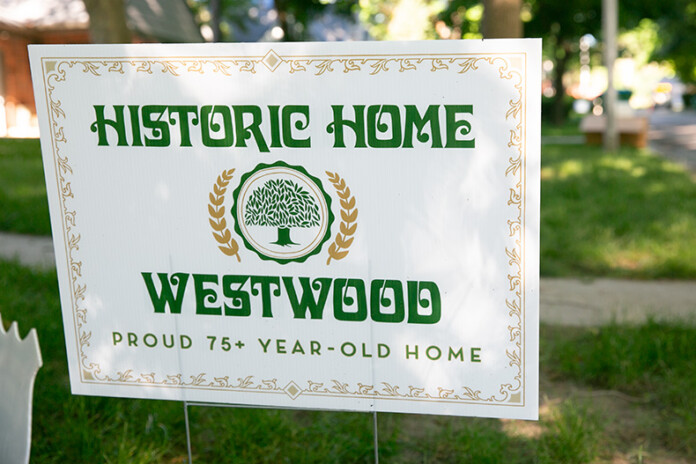 A historic home in Westwood sign to celebrate 75 years of the city's incorporation.