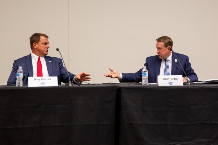 Doug Bedford, left, and Sheriff Calvin Hayden during an exchange at a forum Tuesday night hosted by the Johnson County Post. Photo credit Kylie Graham.