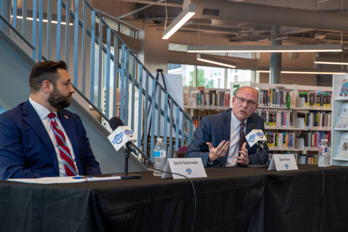 Two candidates at a Johnson County DA forum Tuesday night.