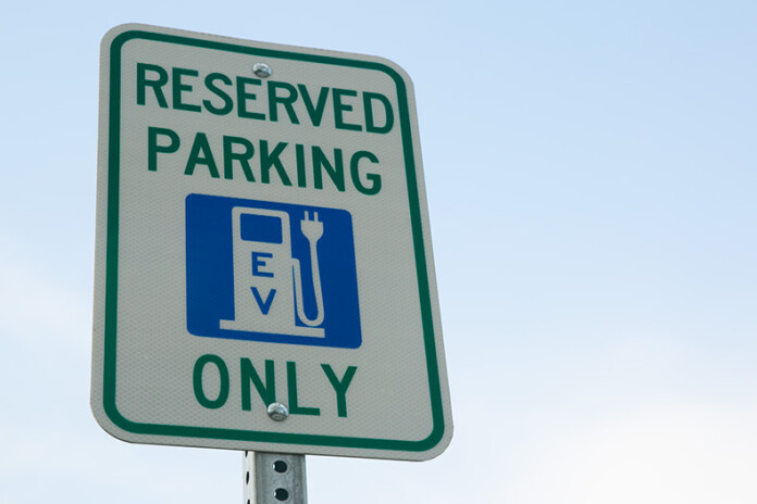 An EV charging station sign in Merriam.